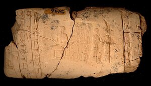 Clay tablet with a sealing enrolled onto it. It shows the worshiping of a seated bearded god with hand extended holding a small vase. He has the usual turban, fringed shawl, seat covered with flounced material and resting on a dais. The divine attendant leads the shaven and shorn worshiper. The inscription reads: Shulgi. valiant hero, King of Ur, Ur-Dumuzi, the judge, is thy servant. Impress. on a clay tablet. Nippur.