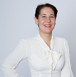 Profile picture of Eva Stöckert, wearing a white blouse.
