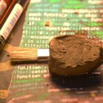 Ancient West Asian clay sealing with cuneiform on printed programming code – representing the KIŠIB digital corpus project.