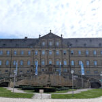 A very grand monastery with a monumental way upwards, right and left to the main entrance of the building.