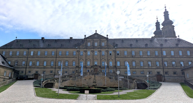 A very grand monastery with a monumental way upwards, right and left to the main entrance of the building.