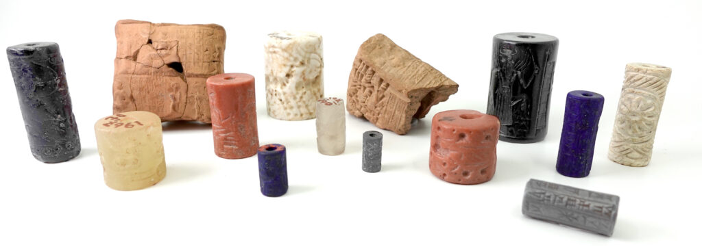 A selection of various seals and two sealed objects. The seals show a variety of colours and styles, some with text, some with images.